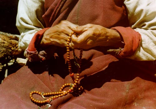 Tibetan nun with rosary